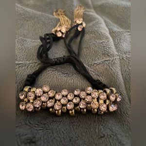 Betsey Johnson tassel bracelet with pink rhinestones.